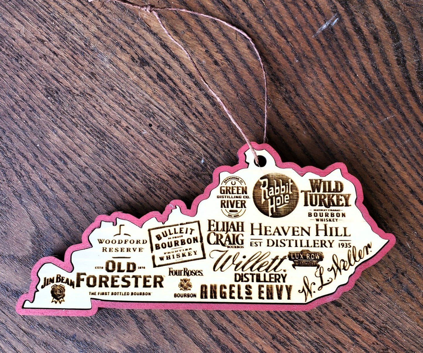 Kentucky Bourbon Ornament by The Hollow & Hill Co. LLC, decorative ornament featuring bourbon-themed design on a clear background.