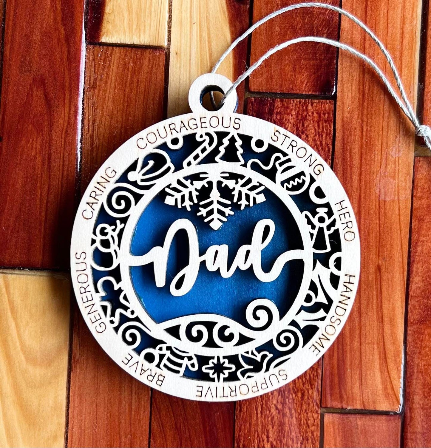 Two-layer wooden dad ornament from The Hollow & Hill Co. LLC, featuring intricate carved design and natural wood finish.