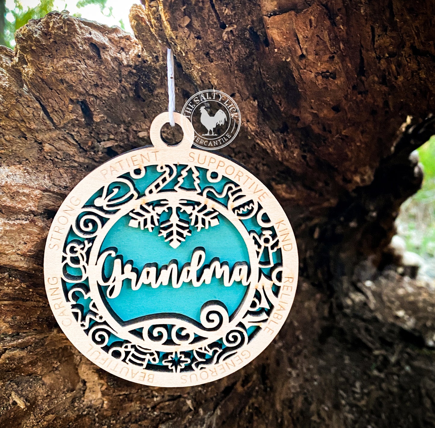 Two-layer wooden ornament featuring a grandma design, crafted by The Hollow & Hill Co. LLC, displayed in a close-up photo.