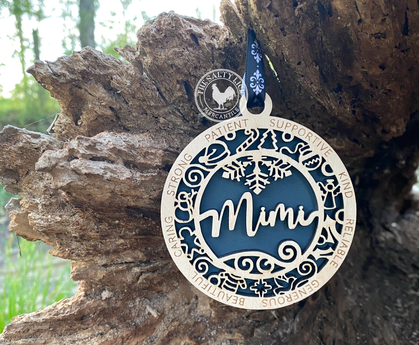 Two-layer wooden ornament from The Hollow & Hill Co. LLC, showcasing intricate design and natural wood finish.