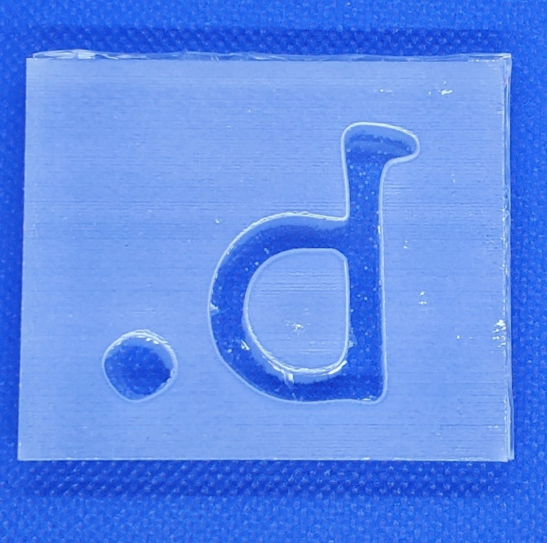 Custom soap stamp from The Hollow & Hill Co. LLC showing a detailed carved design for stamping soap.