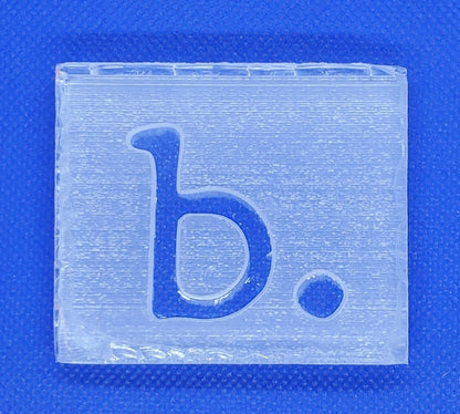 Custom soap stamp from The Hollow & Hill Co. LLC featuring a detailed carved design for personalized soap making.