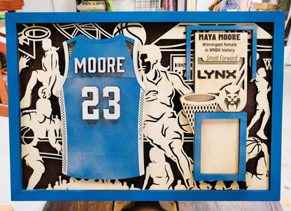 Personalized wood basketball sports sign from The Hollow & Hill Co., featuring male and female jersey design for basketball fans.
